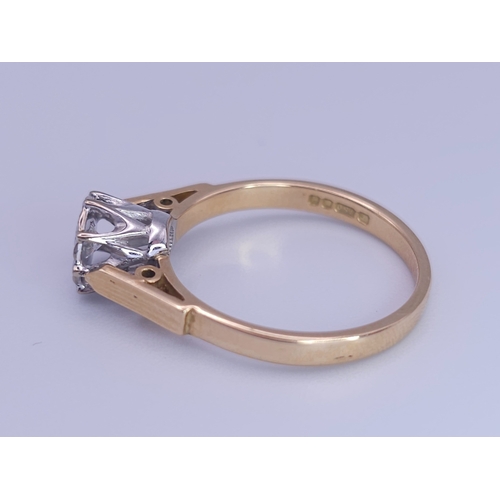 348 - AN 18K YELLOW GOLD DIAMOND SOLITAIRE RING. 3.4G. SIZE O.