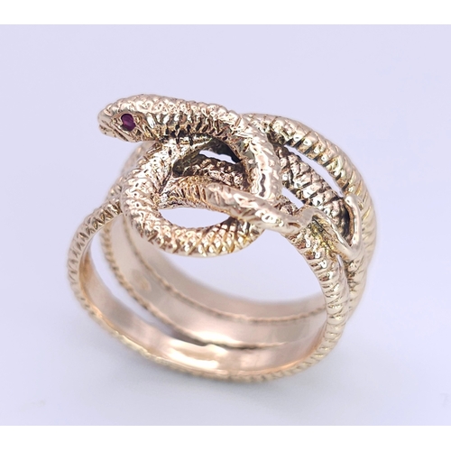 366 - A 9K Yellow Gold Serpent Ring. A three band coiled body, ready to strike with ruby eyes. Size M 1/2.... 