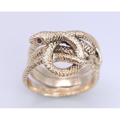 366 - A 9K Yellow Gold Serpent Ring. A three band coiled body, ready to strike with ruby eyes. Size M 1/2.... 