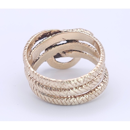 366 - A 9K Yellow Gold Serpent Ring. A three band coiled body, ready to strike with ruby eyes. Size M 1/2.... 