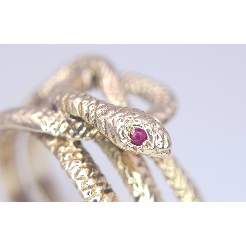 366 - A 9K Yellow Gold Serpent Ring. A three band coiled body, ready to strike with ruby eyes. Size M 1/2.... 