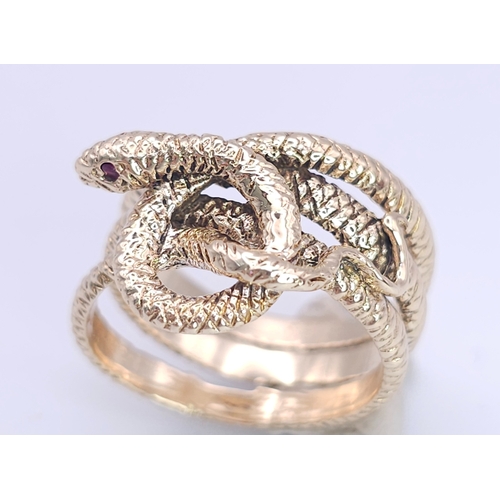 366 - A 9K Yellow Gold Serpent Ring. A three band coiled body, ready to strike with ruby eyes. Size M 1/2.... 