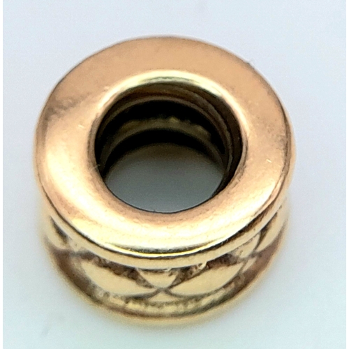 433 - A 14K YELLOW GOLD PANDORA CHARM. 8mm diameter, 2.5g weight. Ref: SC 8136