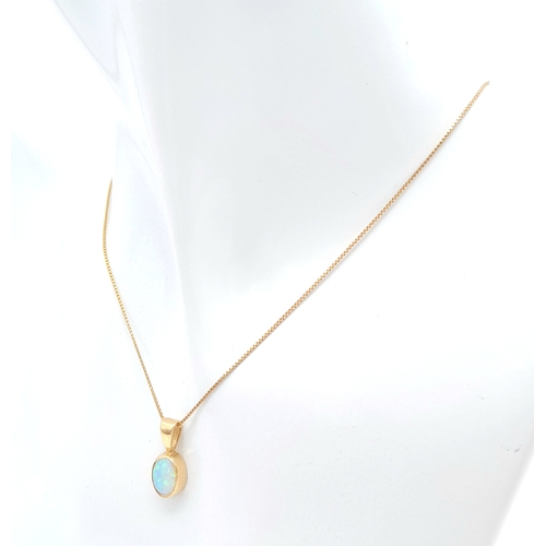 458 - A 9k yellow gold opal pendant on 18 inch box chain 2.1g. approx 15mm x 7mm pendant.

ref: TB03