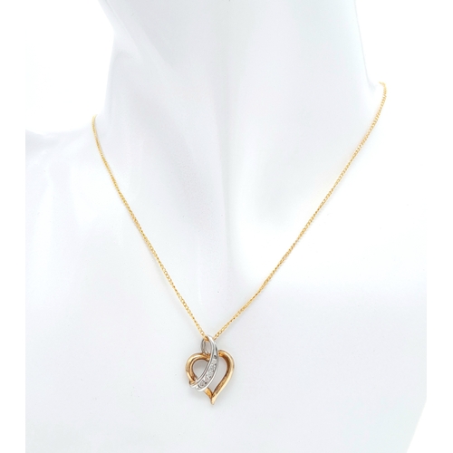 499 - A 9 K yellow gold chain necklace with a heart pendant beautifully crossed over with a band of diamon... 