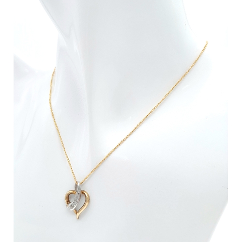 499 - A 9 K yellow gold chain necklace with a heart pendant beautifully crossed over with a band of diamon... 