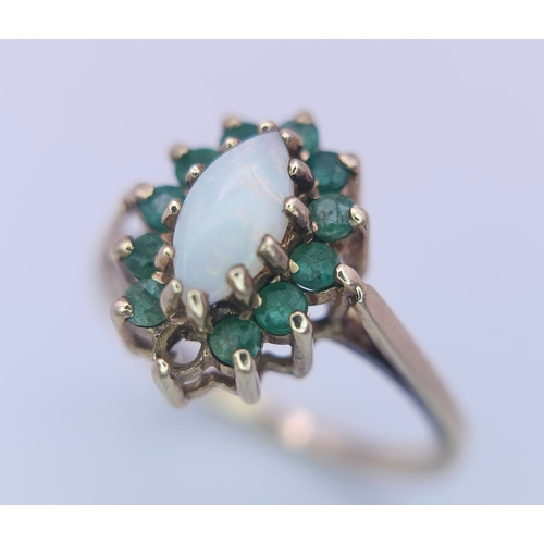 523 - A 9K YELLOW GOLD OPAL & EMERALD CLUSTER RING. (1 stone missing)
Size M, 2.5g total weight. Ref: SC 8... 