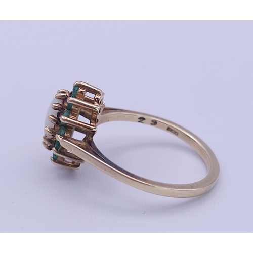 523 - A 9K YELLOW GOLD OPAL & EMERALD CLUSTER RING. (1 stone missing)
Size M, 2.5g total weight. Ref: SC 8... 