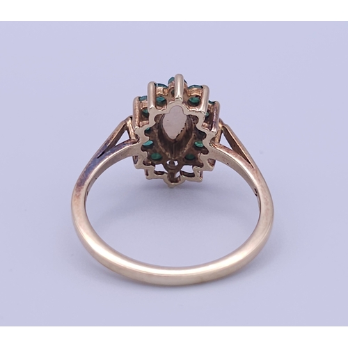 523 - A 9K YELLOW GOLD OPAL & EMERALD CLUSTER RING. (1 stone missing)
Size M, 2.5g total weight. Ref: SC 8... 