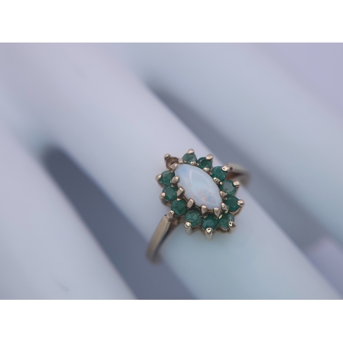 523 - A 9K YELLOW GOLD OPAL & EMERALD CLUSTER RING. (1 stone missing)
Size M, 2.5g total weight. Ref: SC 8... 