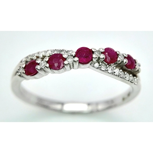 530 - A 9K WHITE GOLD DIAMOND & RUBY RING. Size O 1/2, 2.2g total weight. Ref: SC 8046