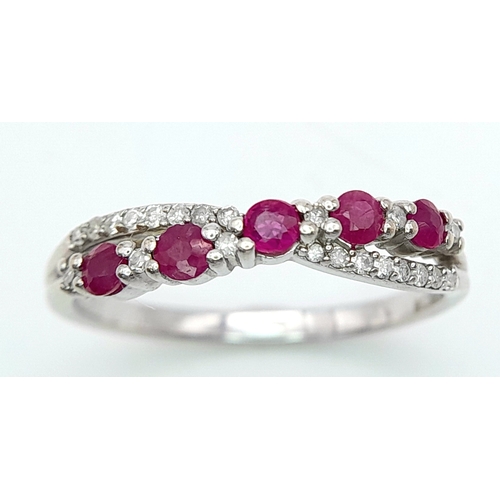 530 - A 9K WHITE GOLD DIAMOND & RUBY RING. Size O 1/2, 2.2g total weight. Ref: SC 8046