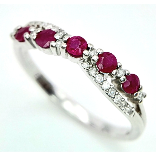 530 - A 9K WHITE GOLD DIAMOND & RUBY RING. Size O 1/2, 2.2g total weight. Ref: SC 8046