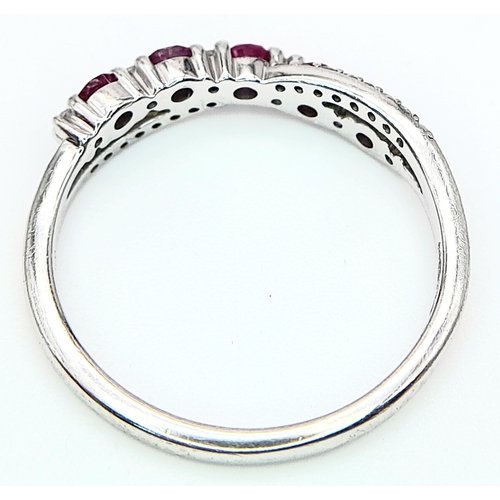 530 - A 9K WHITE GOLD DIAMOND & RUBY RING. Size O 1/2, 2.2g total weight. Ref: SC 8046