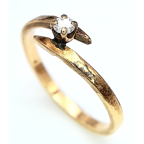 547 - A 14ct Yellow Gold (tested as) Diamond Crossover Ring, 0.05ct diamond, size I, 1.3g weight.

ref: SH... 