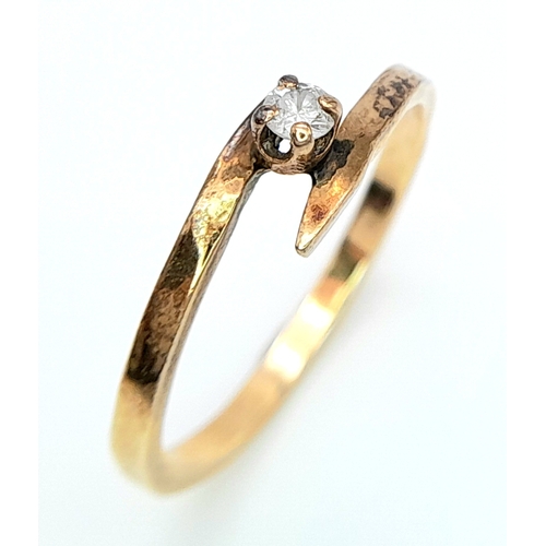 547 - A 14ct Yellow Gold (tested as) Diamond Crossover Ring, 0.05ct diamond, size I, 1.3g weight.

ref: SH... 