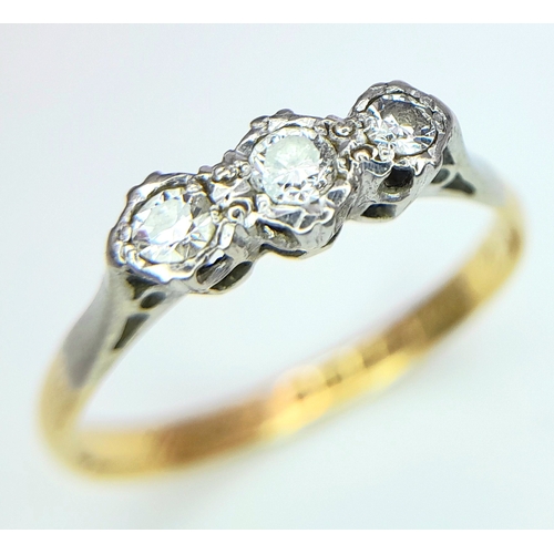 355 - A VINTAGE 18K YELLOW GOLD, PLATINUM AND DIAMOND 3 STONE RING. 0.15CT. 2.2G. SIZE O