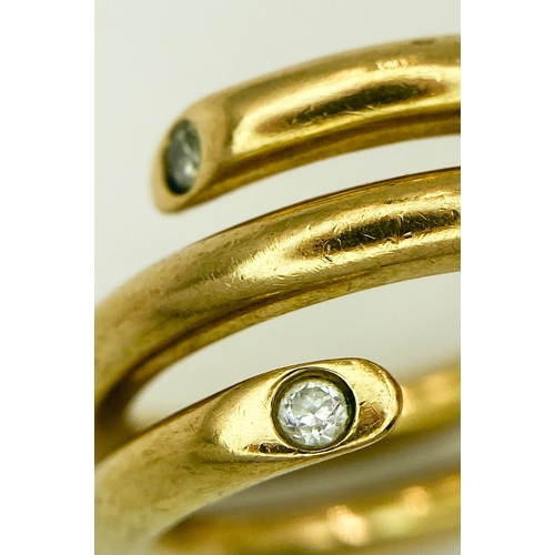 40 - A 9K YELLOW GOLD, SERPENT STYLE DIAMOND BAND RING. 10G.  SIZE T.