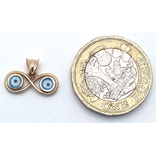 670 - A 14K YELLOW GOLD EVIL EYE INFINITY CHARM/PENDANT. 1.5cm x 1.1cm, 1g total weight. Ref: SC 8056