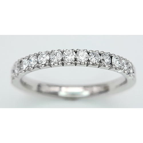 142 - AN 18K WHITE GOLD DIAMOND HALF ETERNITY RING. 0.50ctw, size L, 2.6g total weight. Ref: SC 8075