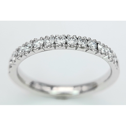 142 - AN 18K WHITE GOLD DIAMOND HALF ETERNITY RING. 0.50ctw, size L, 2.6g total weight. Ref: SC 8075