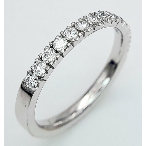 142 - AN 18K WHITE GOLD DIAMOND HALF ETERNITY RING. 0.50ctw, size L, 2.6g total weight. Ref: SC 8075