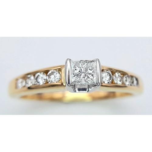 297 - An 18K Yellow Gold Princess Cut Diamond Ring. 0.30ct central diamond with four graduated round cut d... 