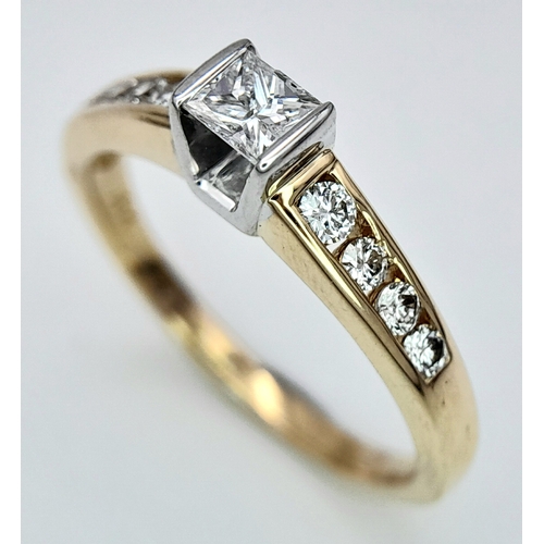 297 - An 18K Yellow Gold Princess Cut Diamond Ring. 0.30ct central diamond with four graduated round cut d... 