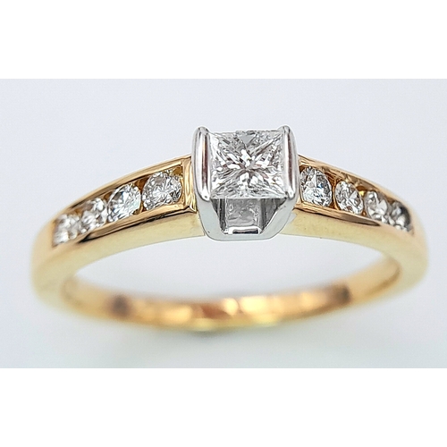 297 - An 18K Yellow Gold Princess Cut Diamond Ring. 0.30ct central diamond with four graduated round cut d... 