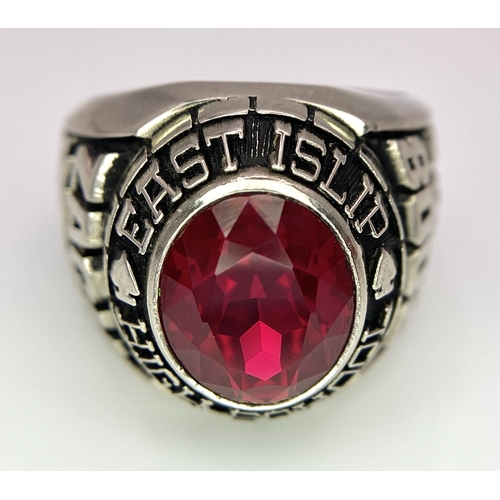 304 - A 10K White Gold and Ruby Gents High School Ring. Size P 1/2. 18g total weight. Ref: 17043