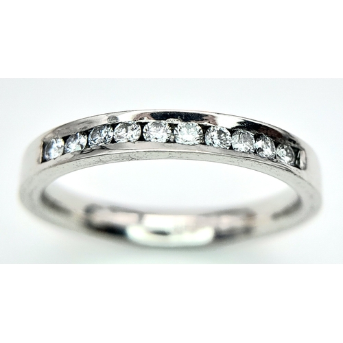 162 - A PLATINUM DIAMOND HALF ETERNITY RING. 0.25ctw, size J, 4.1g total weight. Ref: SC 9078