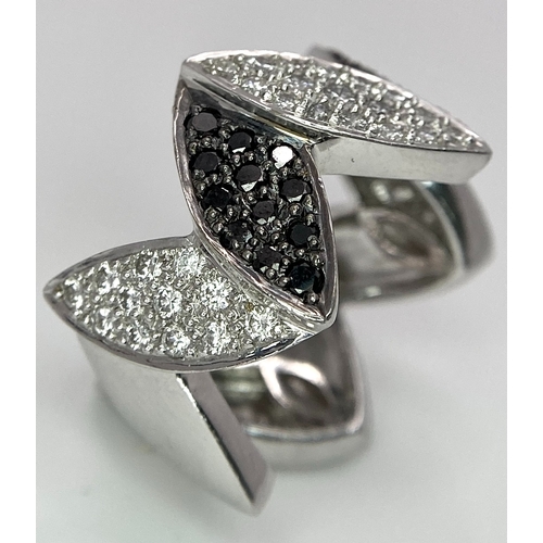 177 - AN 18K WHITE GOLD BLACK & WHITE DIAMOND SET RING. 0.80ctw, size N, 11.8g total weight.