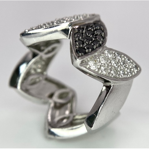 177 - AN 18K WHITE GOLD BLACK & WHITE DIAMOND SET RING. 0.80ctw, size N, 11.8g total weight.