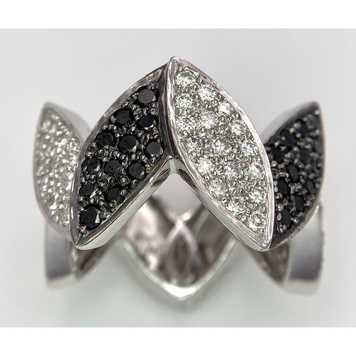 177 - AN 18K WHITE GOLD BLACK & WHITE DIAMOND SET RING. 0.80ctw, size N, 11.8g total weight.