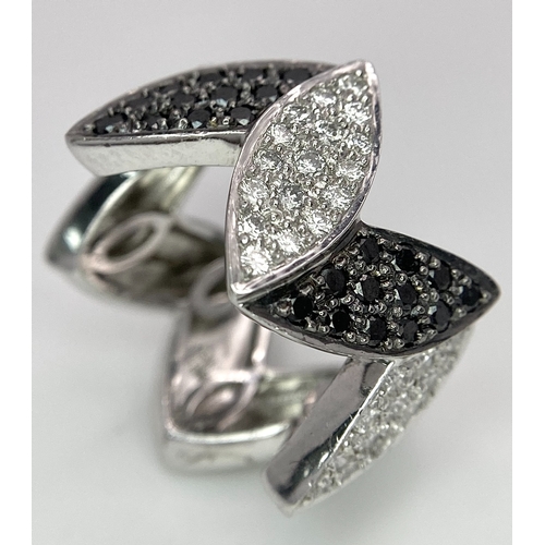 177 - AN 18K WHITE GOLD BLACK & WHITE DIAMOND SET RING. 0.80ctw, size N, 11.8g total weight.