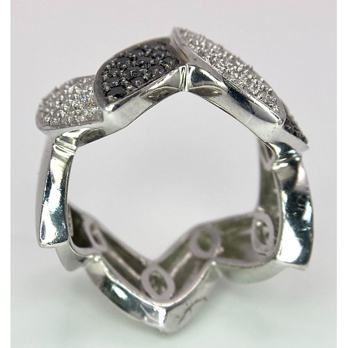 177 - AN 18K WHITE GOLD BLACK & WHITE DIAMOND SET RING. 0.80ctw, size N, 11.8g total weight.