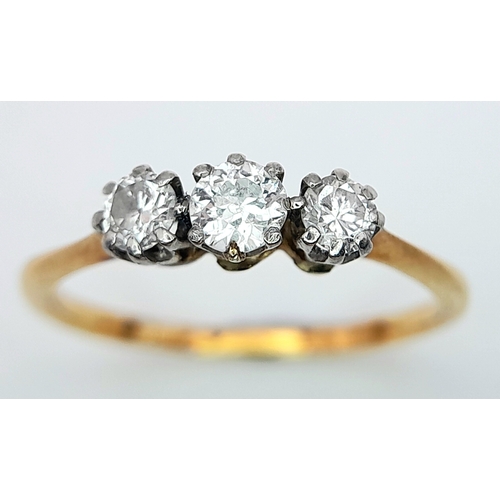 278 - AN 18K YELLOW GOLD DIAMOND 3 STONE RING. 0.30CT. 1.4G. SIZE J.