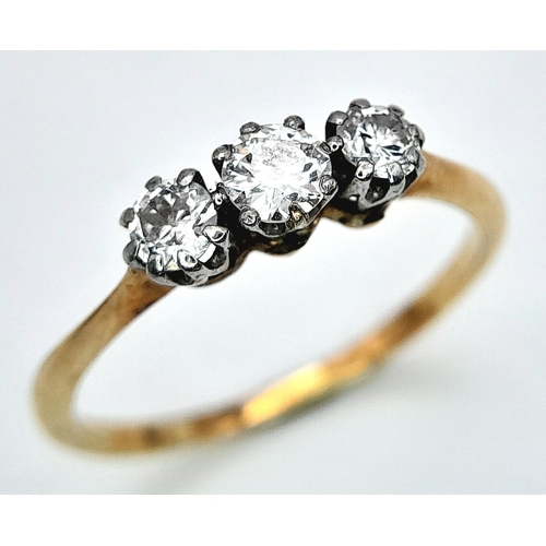 278 - AN 18K YELLOW GOLD DIAMOND 3 STONE RING. 0.30CT. 1.4G. SIZE J.