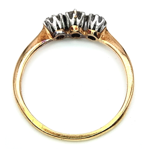 278 - AN 18K YELLOW GOLD DIAMOND 3 STONE RING. 0.30CT. 1.4G. SIZE J.