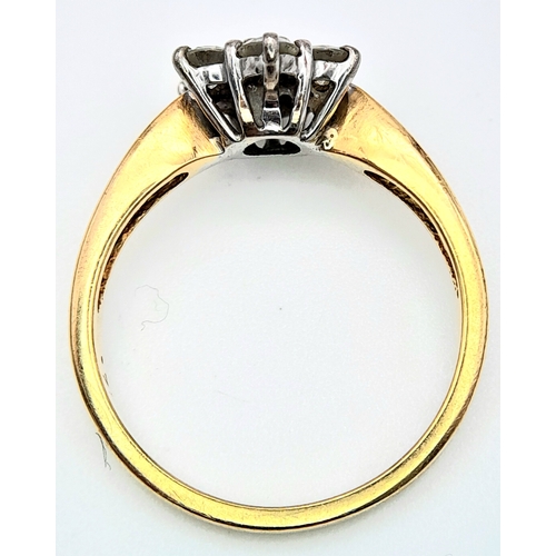 289 - An 18K Yellow Gold Diamond Ring. Seven diamonds in a floral shape - 0.7ctw. Size O. 4.2g total weigh... 