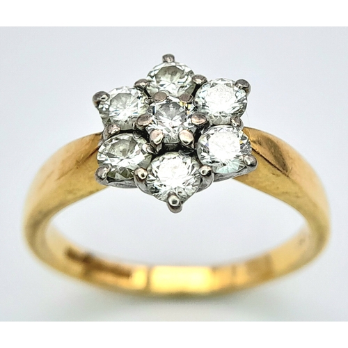 289 - An 18K Yellow Gold Diamond Ring. Seven diamonds in a floral shape - 0.7ctw. Size O. 4.2g total weigh... 