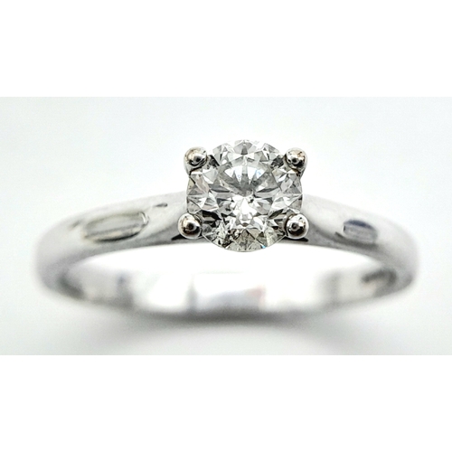 262 - An 18K White Gold Diamond Solitaire Ring. 0.50ct brilliant round cut, slightly tinted. Size N. 2.8g ... 