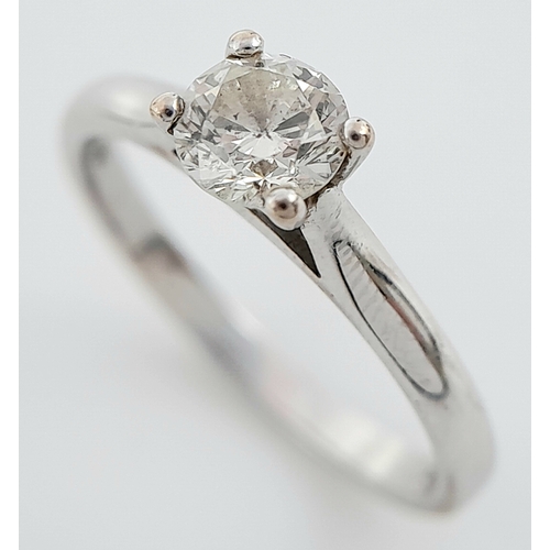 262 - An 18K White Gold Diamond Solitaire Ring. 0.50ct brilliant round cut, slightly tinted. Size N. 2.8g ... 