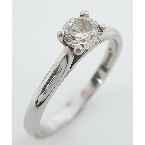 262 - An 18K White Gold Diamond Solitaire Ring. 0.50ct brilliant round cut, slightly tinted. Size N. 2.8g ... 