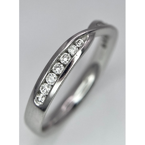 264 - AN 18K WHITE GOLD DIAMOND RING. 0.15CT. 2.7G. SIZE M.