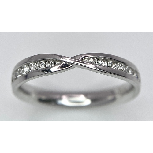 264 - AN 18K WHITE GOLD DIAMOND RING. 0.15CT. 2.7G. SIZE M.