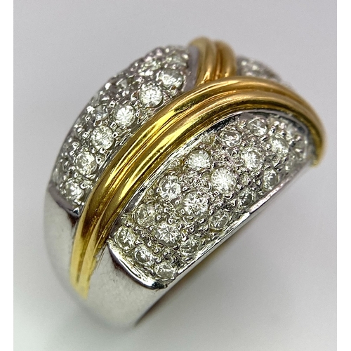 282 - An 18K White and Yellow Gold Diamond Cluster Ring. Three small fields of diamonds separated by golde... 