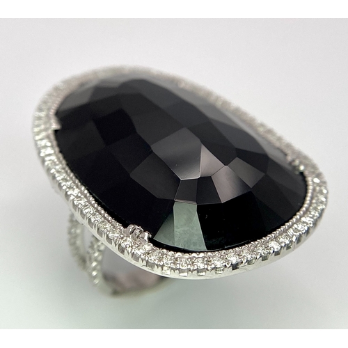 11 - A Beautiful 18k White Gold Black Onyx and Diamond Ladies Dress Ring. Faceted black onyx with a diamo... 