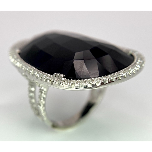 11 - A Beautiful 18k White Gold Black Onyx and Diamond Ladies Dress Ring. Faceted black onyx with a diamo... 