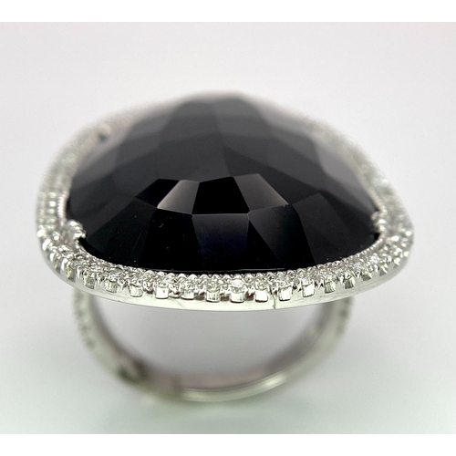 11 - A Beautiful 18k White Gold Black Onyx and Diamond Ladies Dress Ring. Faceted black onyx with a diamo... 